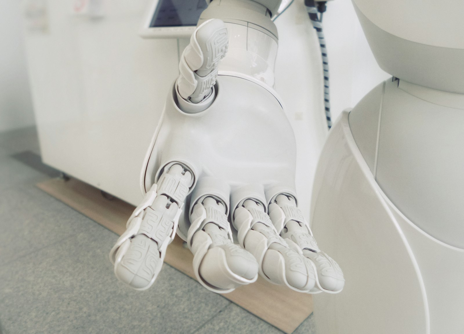 A service robot moving through a public indoor space such as a café or transit hub.